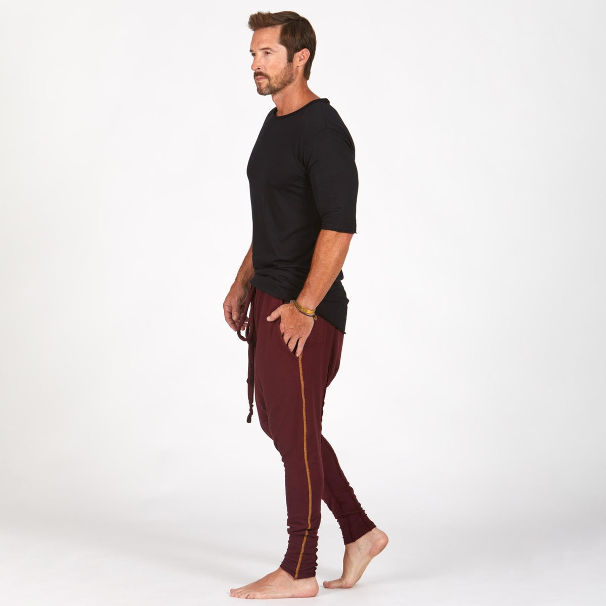 Male modeling Bordeaux colored pants