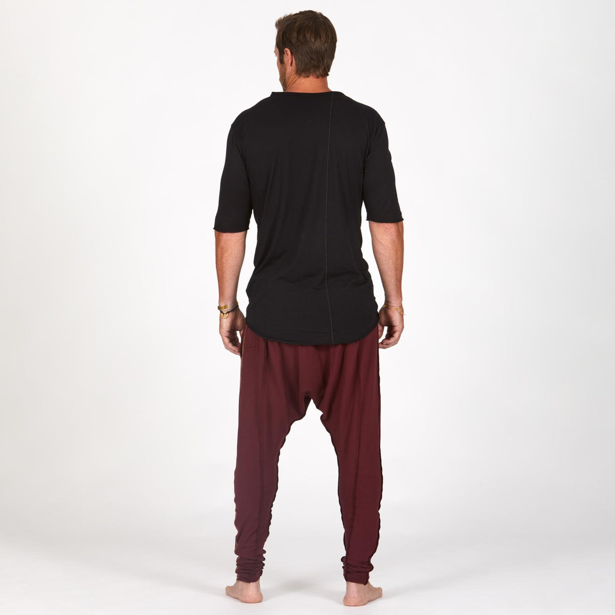 Male modeling Bordeaux colored pants