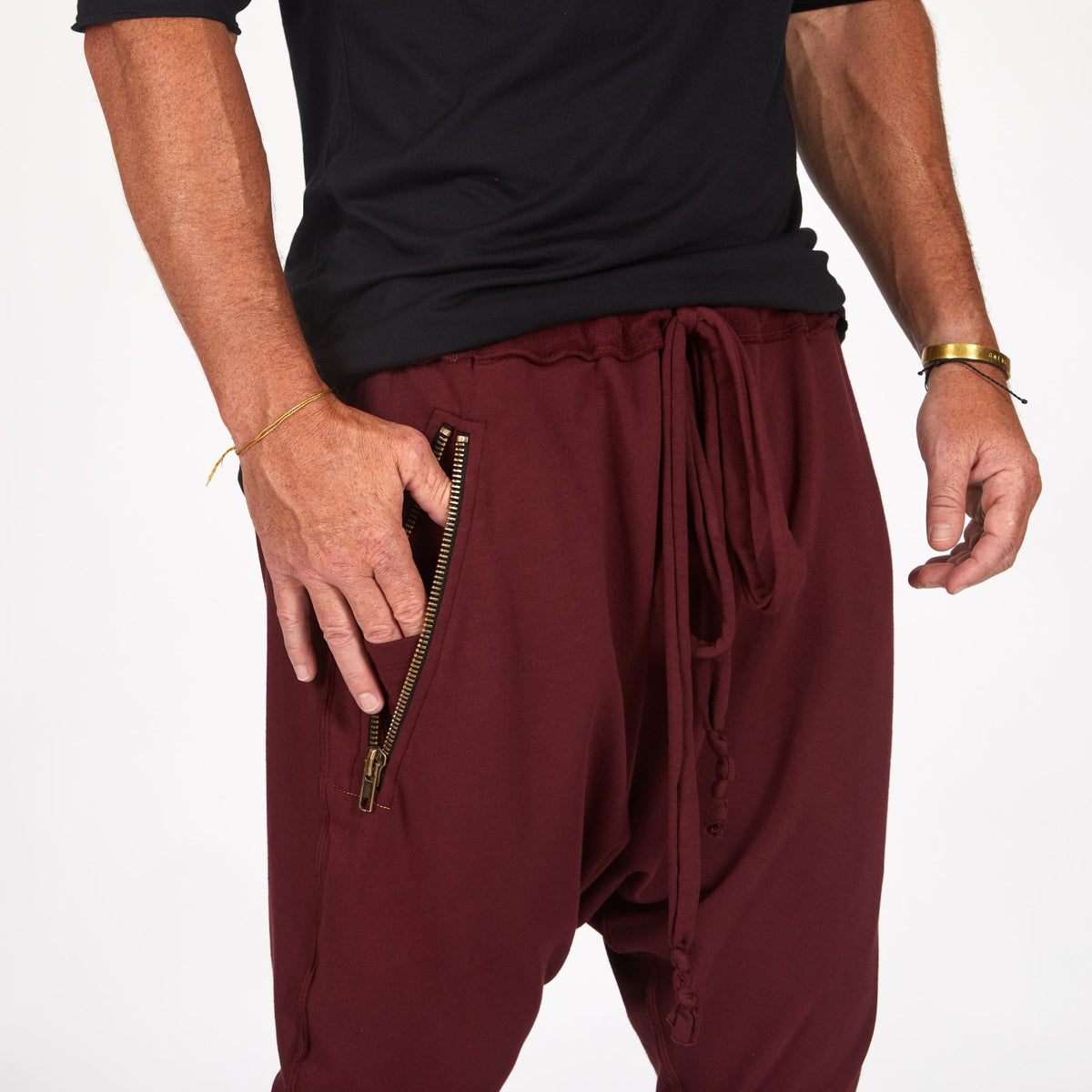 Male modeling Bordeaux colored pants
