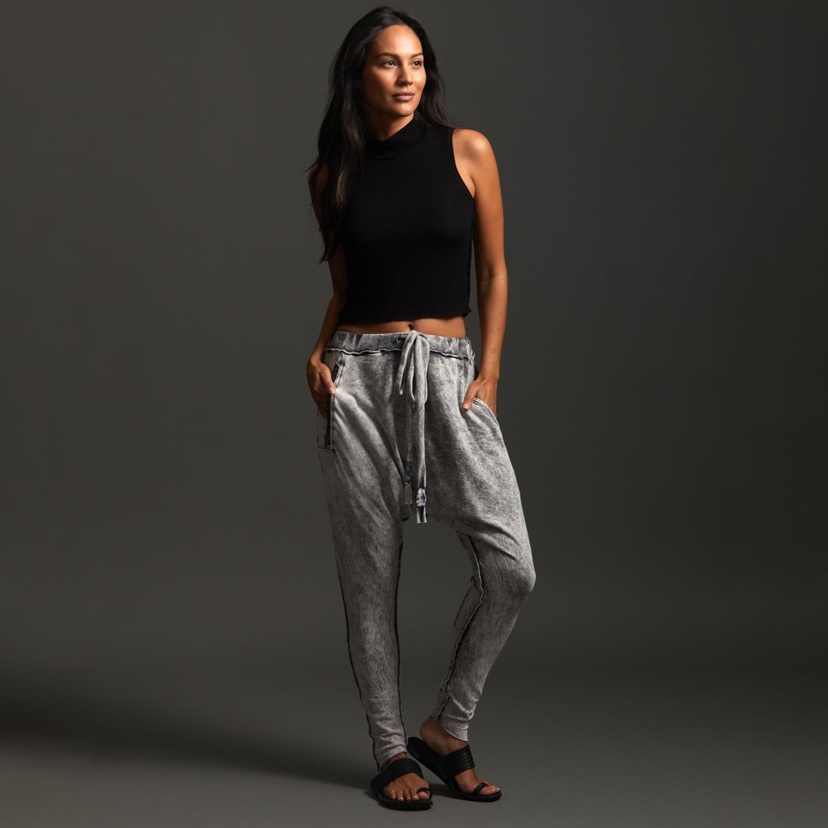 Woman modeling dance pants in Grey Mineral Wash