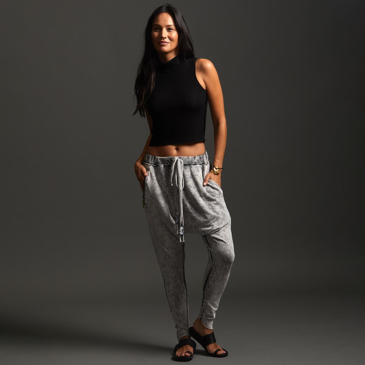 Woman modeling dance pants in Grey Mineral Wash