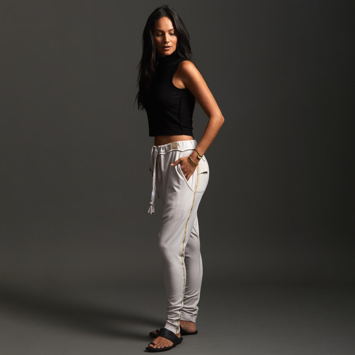 Woman modeling dance pants in White Stone