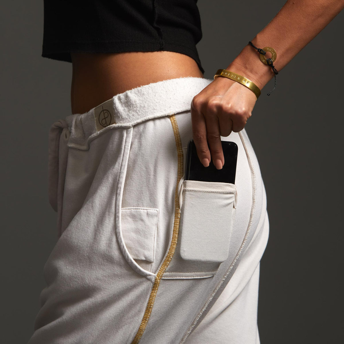 Woman modeling dance pants in White Stone