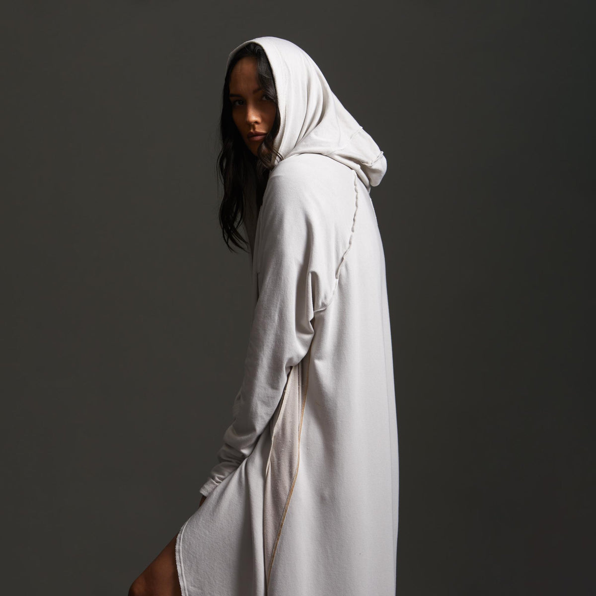 Woman modeling white aion duster