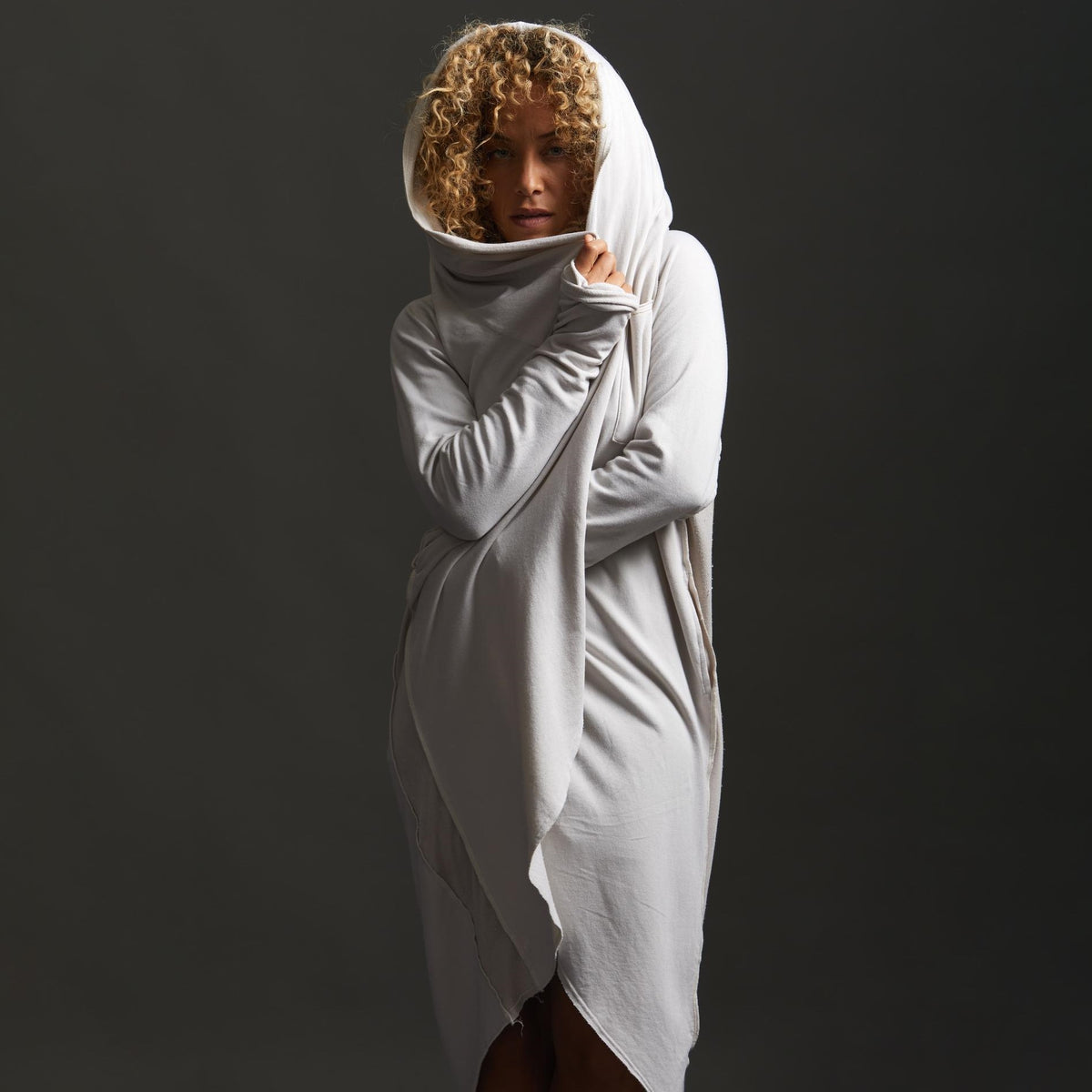 Woman modeling white aion duster
