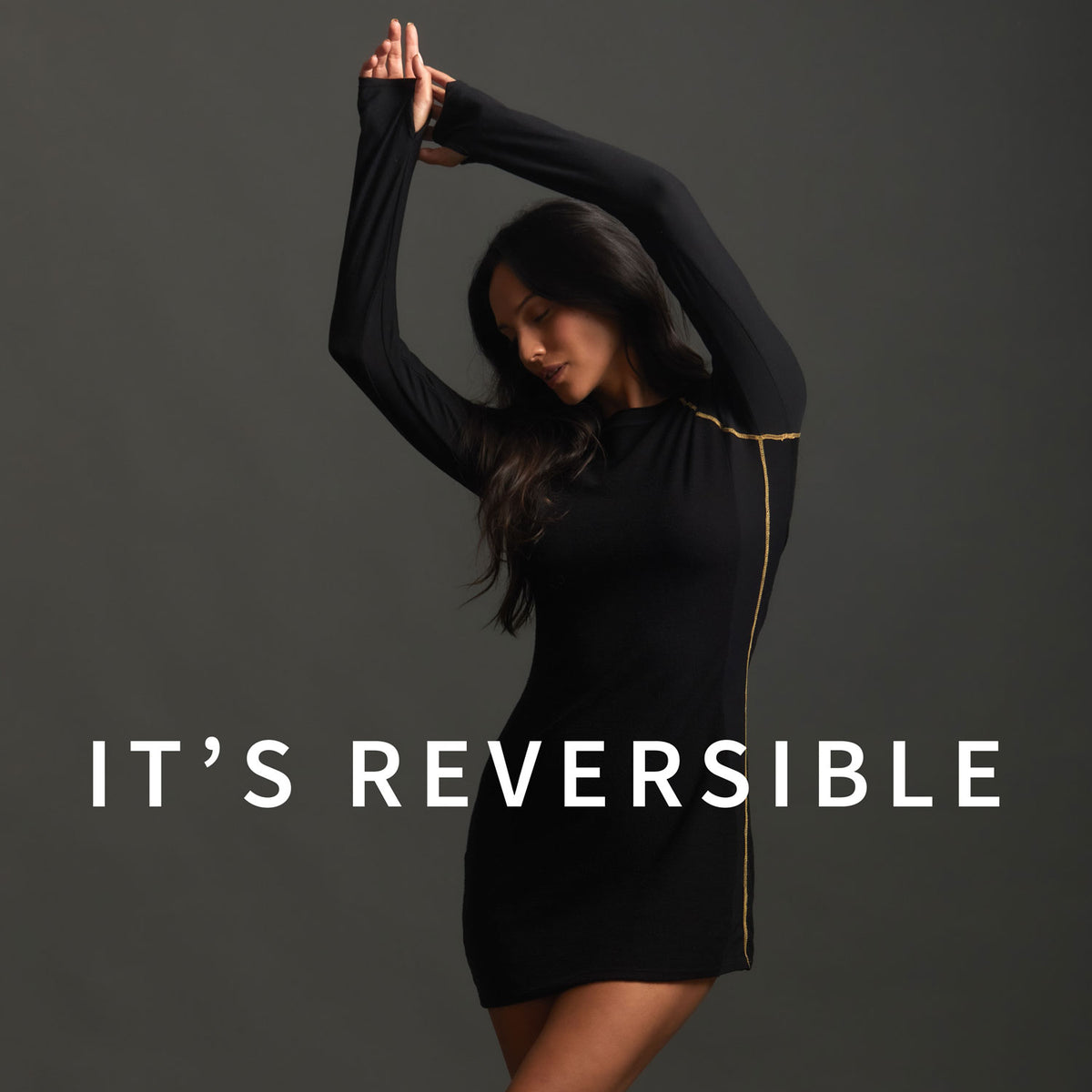 A woman modeling the One Golden Thread Reversible Little Black Dress