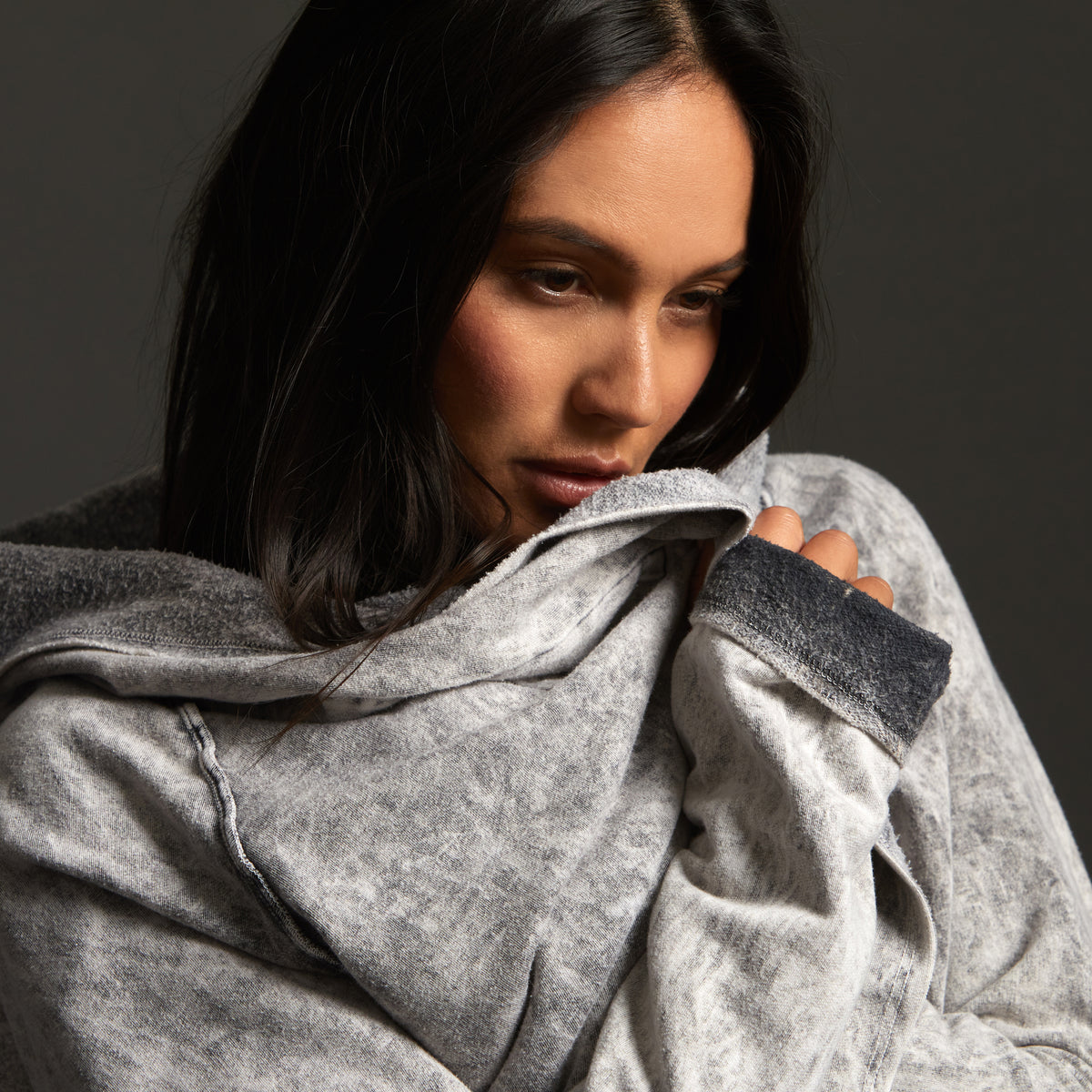 Woman modeling mineral grey aion duster
