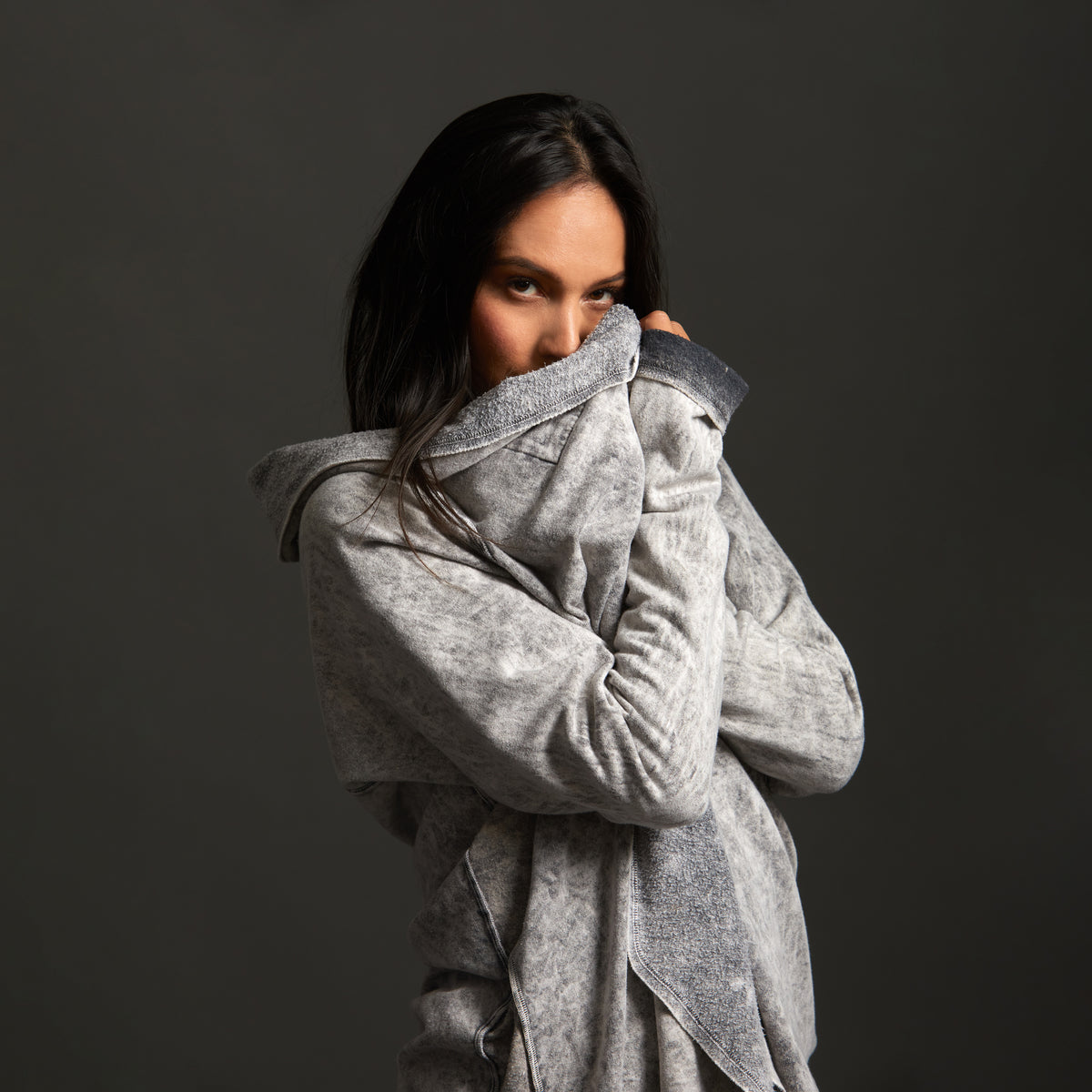Woman modeling mineral grey aion duster