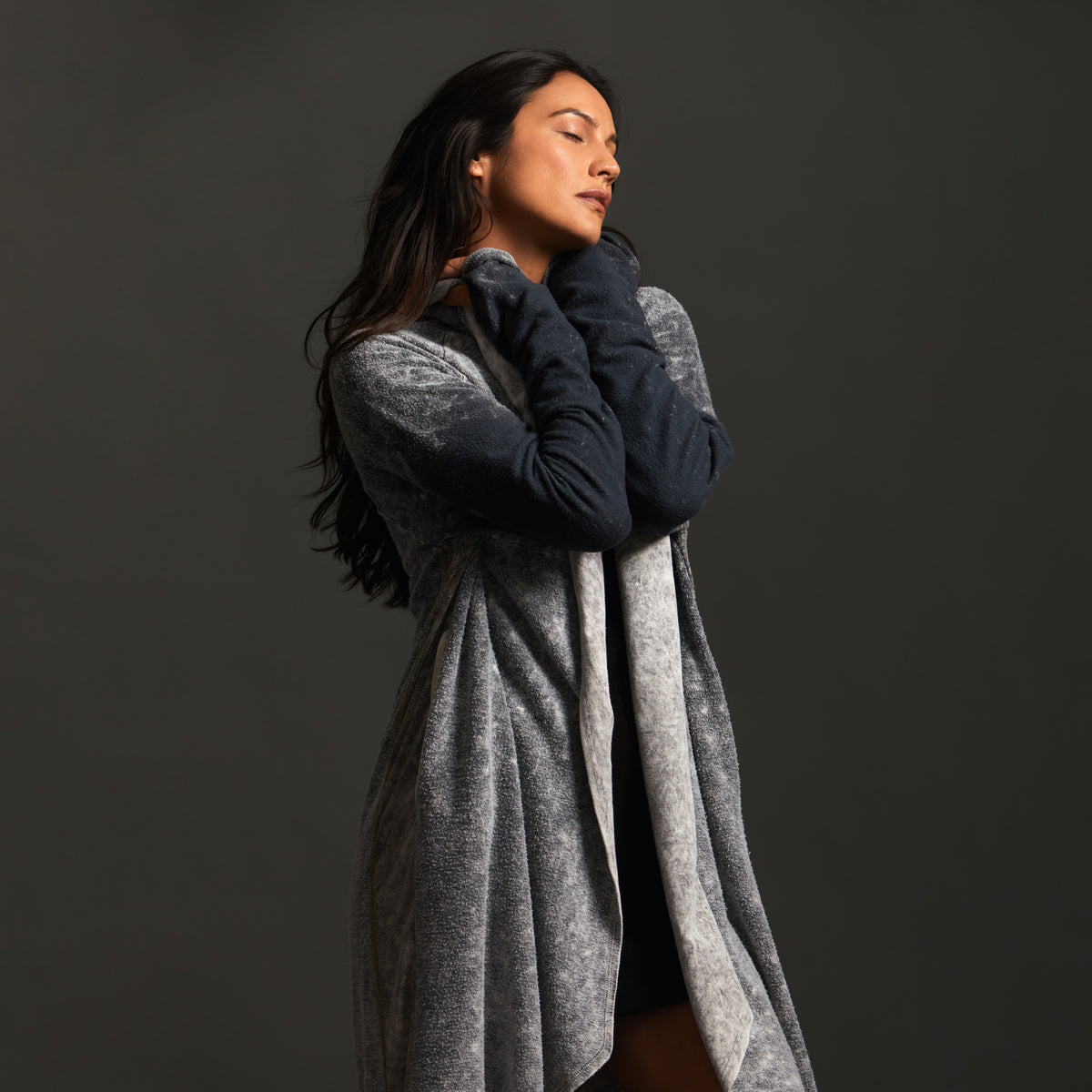 Woman modeling mineral grey aion duster