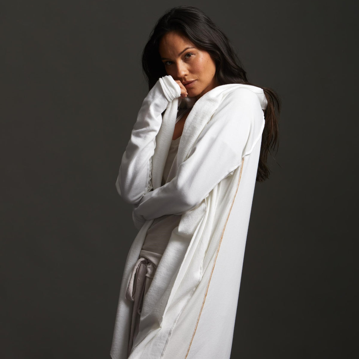 Woman modeling white aion duster