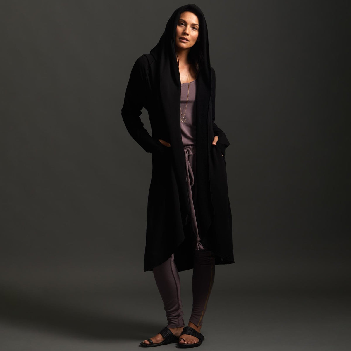 Woman modeling black aion duster
