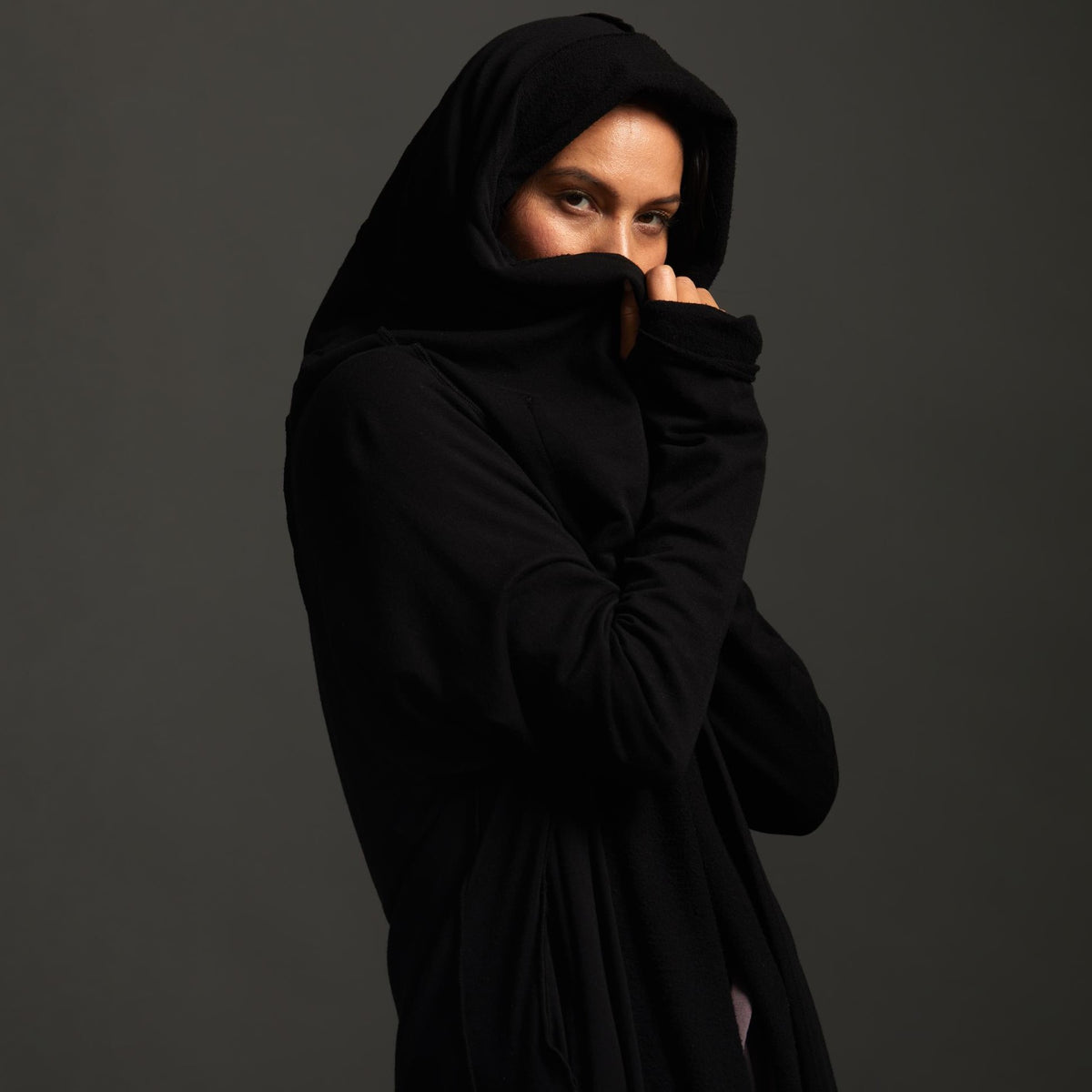 Woman modeling black aion duster