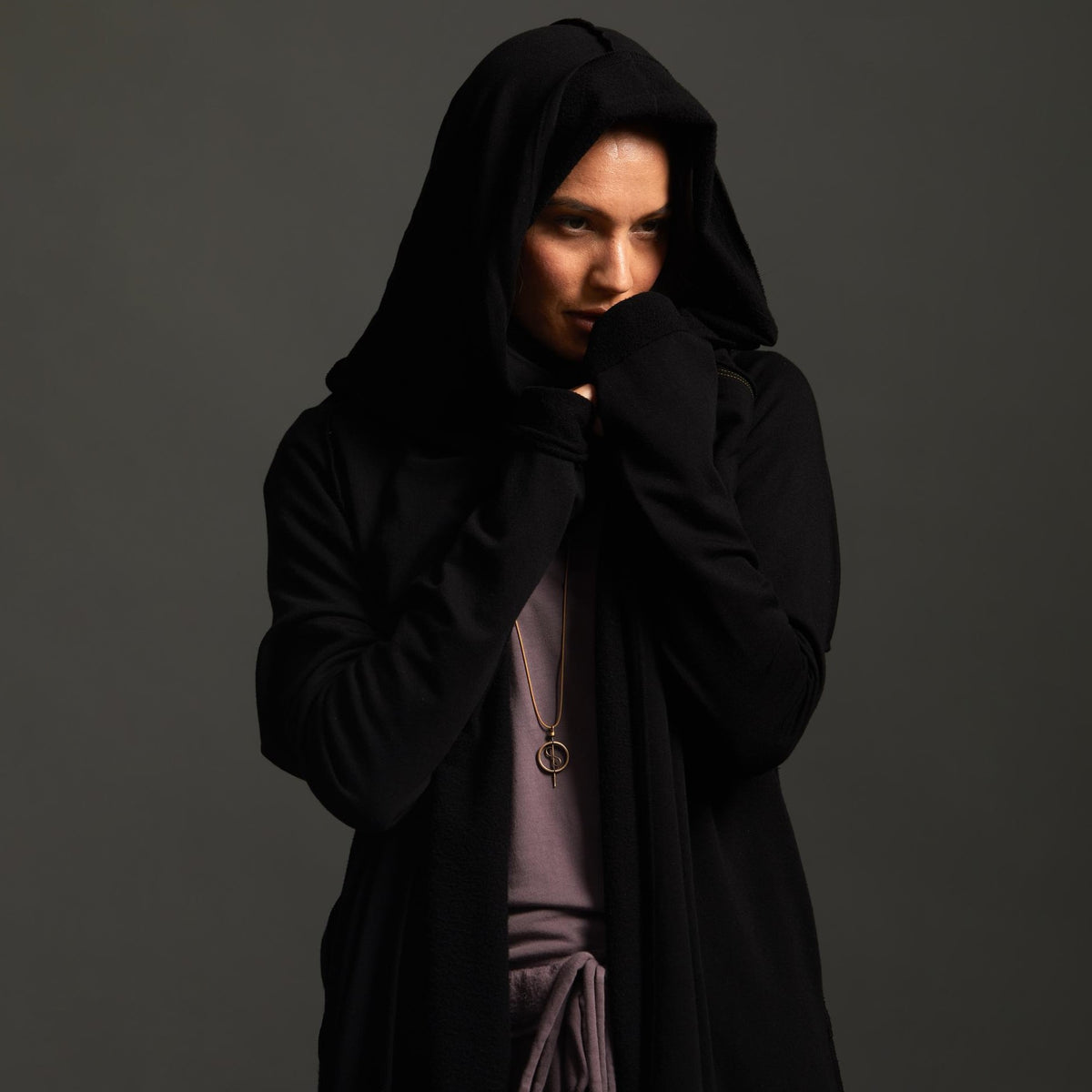 Woman modeling black aion duster