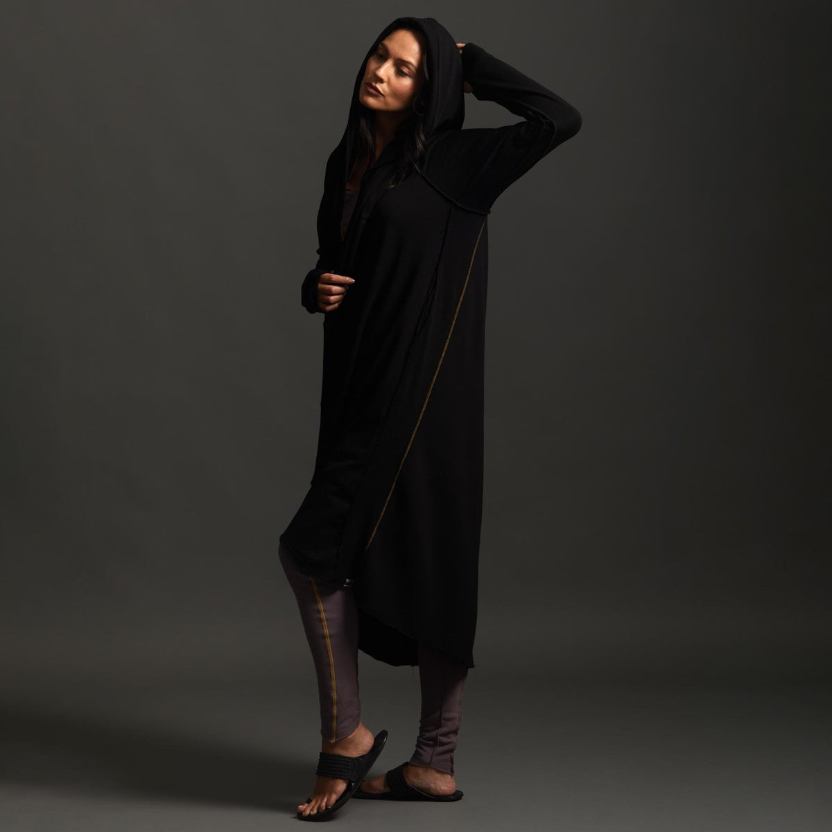 Woman modeling black aion duster