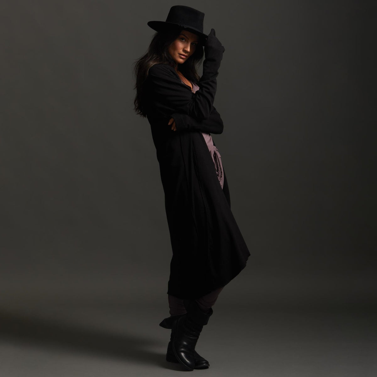 Woman modeling black aion duster