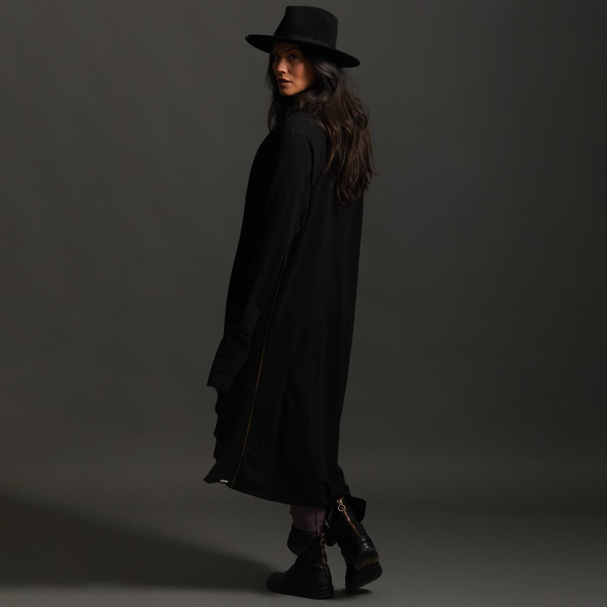 Woman modeling black aion duster