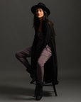 Woman modeling black aion duster