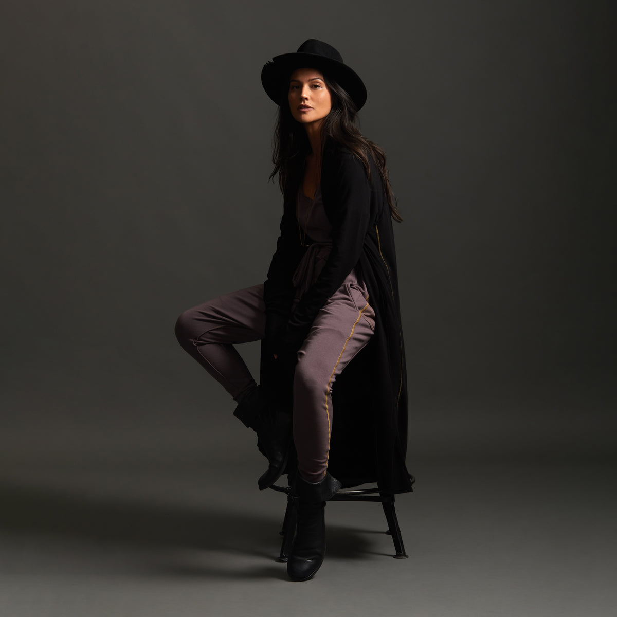 Woman modeling black aion duster