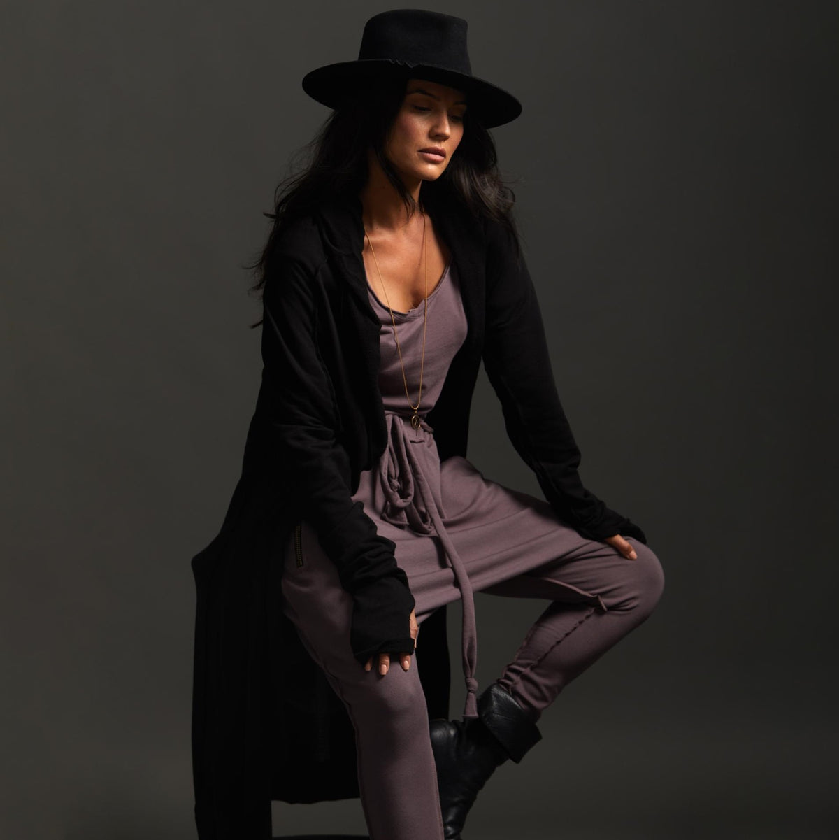 Woman modeling black aion duster