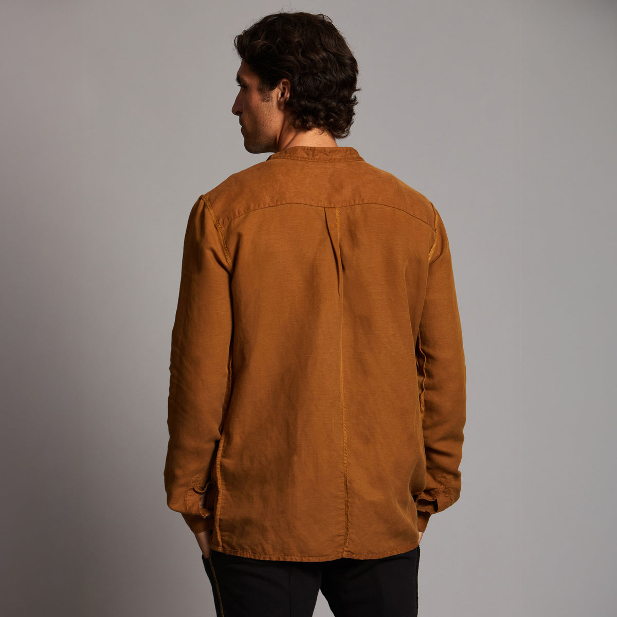 Male modeling Shacket in Whiskey Haze