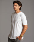 Man modeling Elemental shirt in white