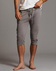 Male modeling Brazen colored yogo mid shorts