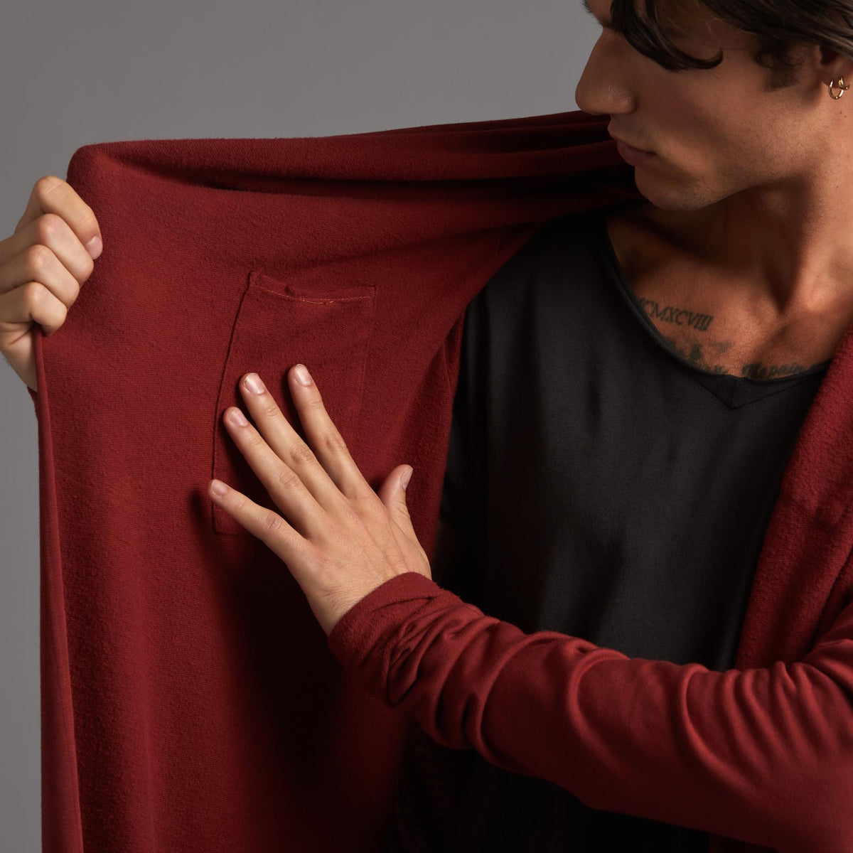 Male modeling red kairos duster