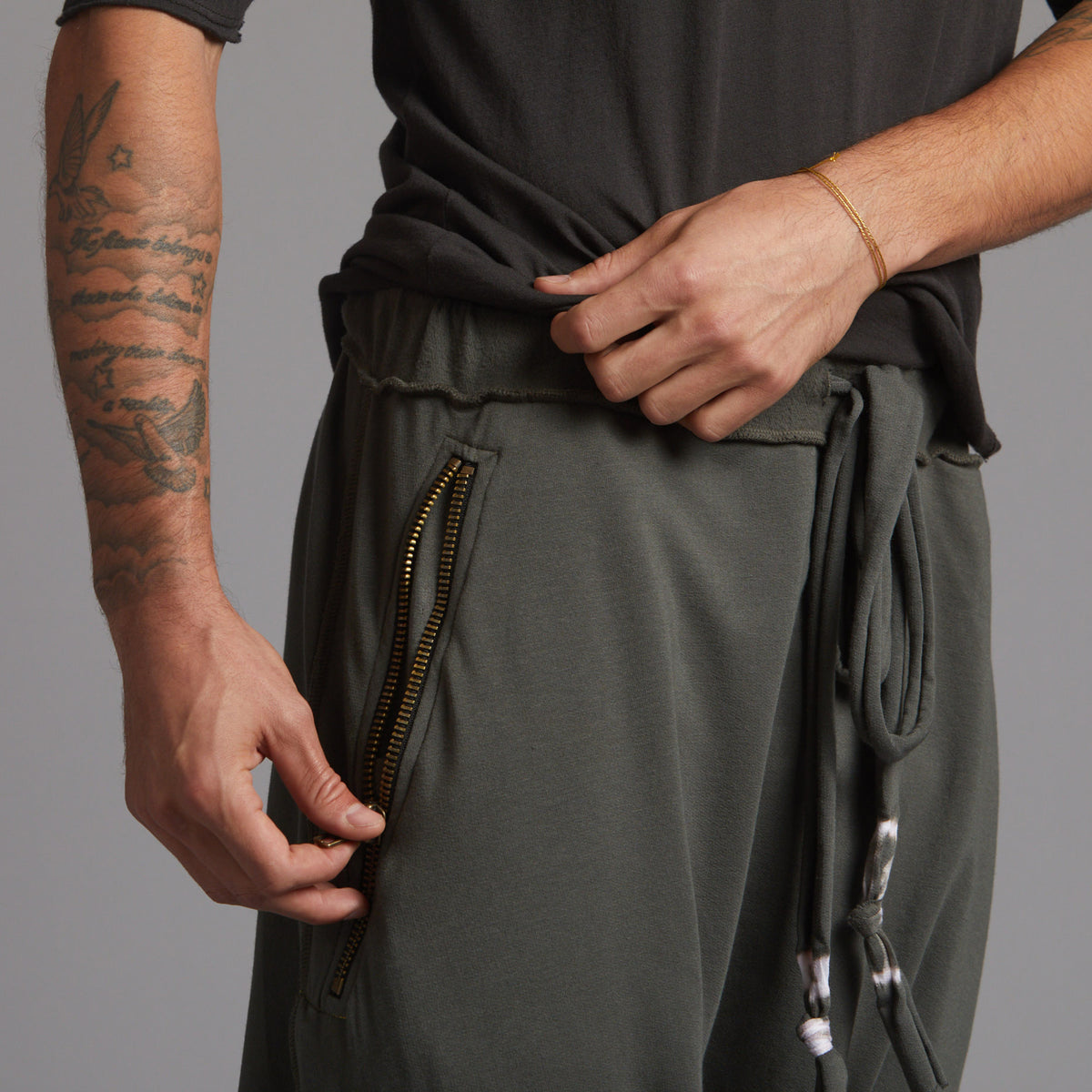 Male modeling Urban Forest green colored pants