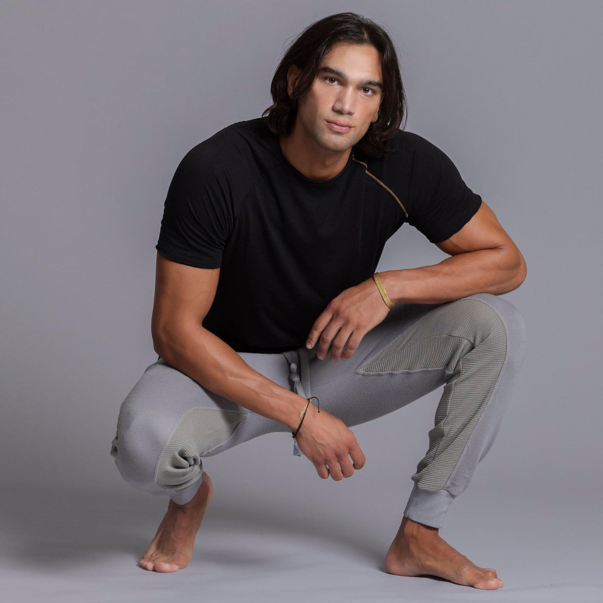 A man modeling Deep Clay gray colored jogger pants