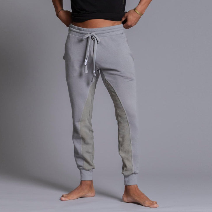 A man modeling Deep Clay gray colored jogger pants