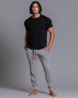 A man modeling Deep Clay gray colored jogger pants