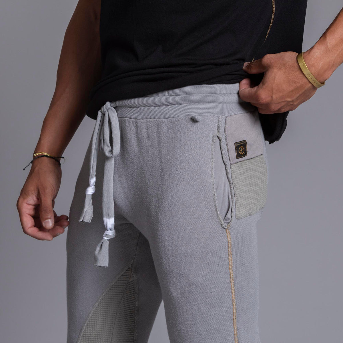 A man modeling Deep Clay gray colored jogger pants