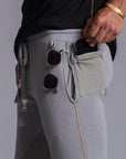 A man modeling Deep Clay gray colored jogger pants