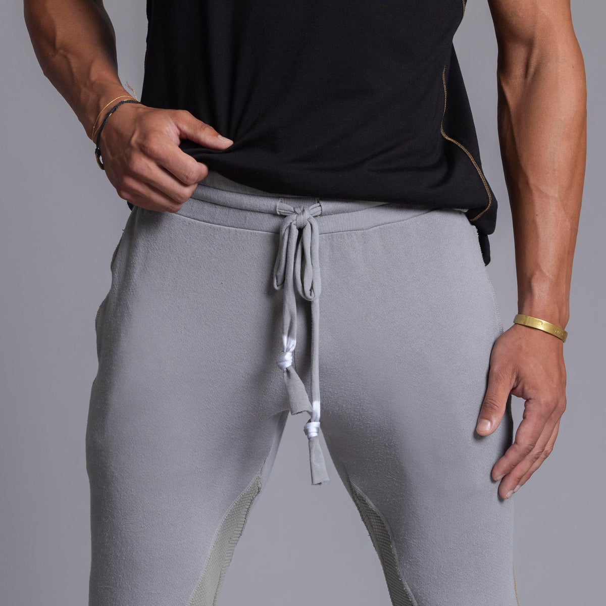 A man modeling Deep Clay gray colored jogger pants