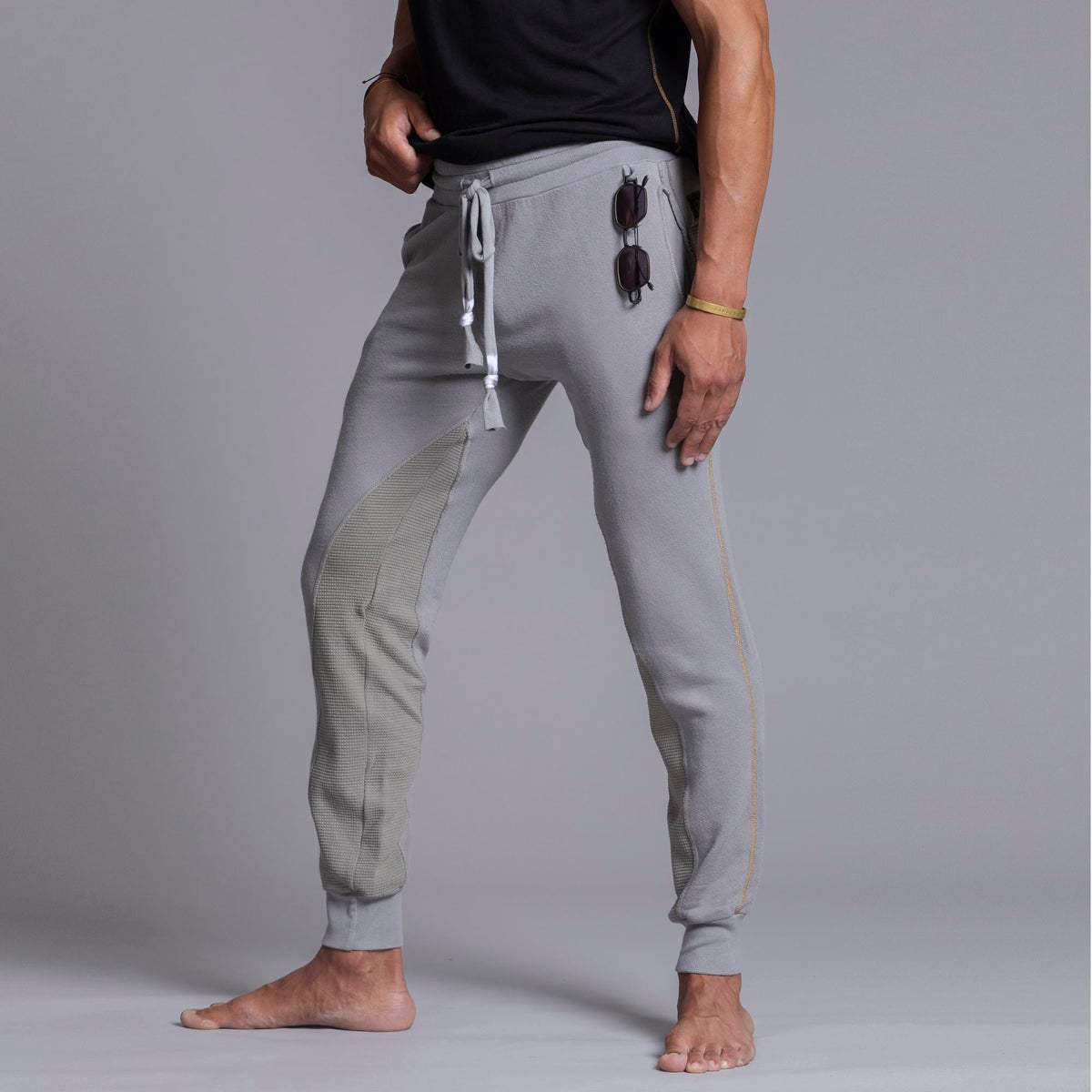 A man modeling Deep Clay gray colored jogger pants