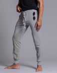 A man modeling Deep Clay gray colored jogger pants