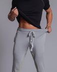 A man modeling Deep Clay gray colored jogger pants