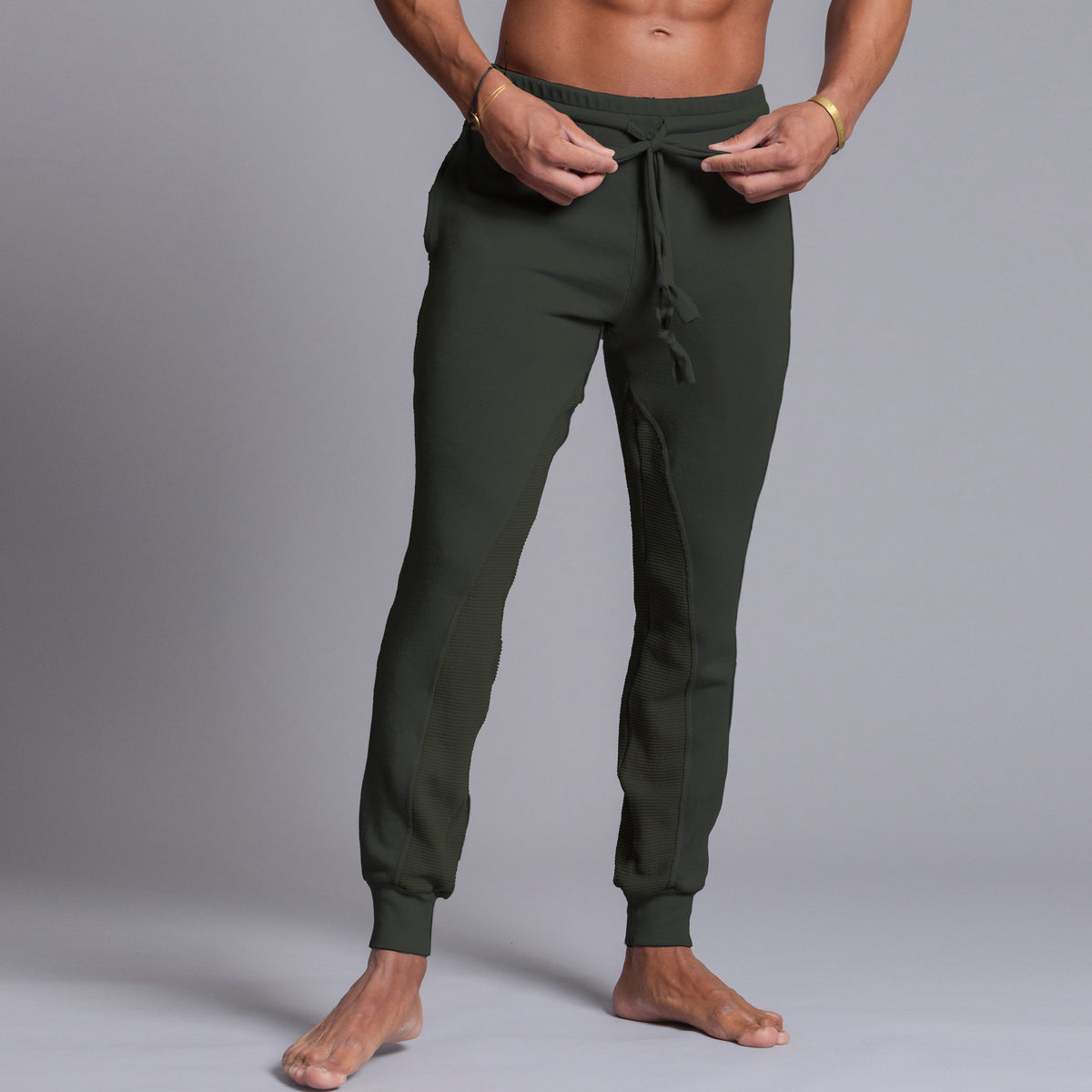 A man modeling Urban Forest green colored jogger pants