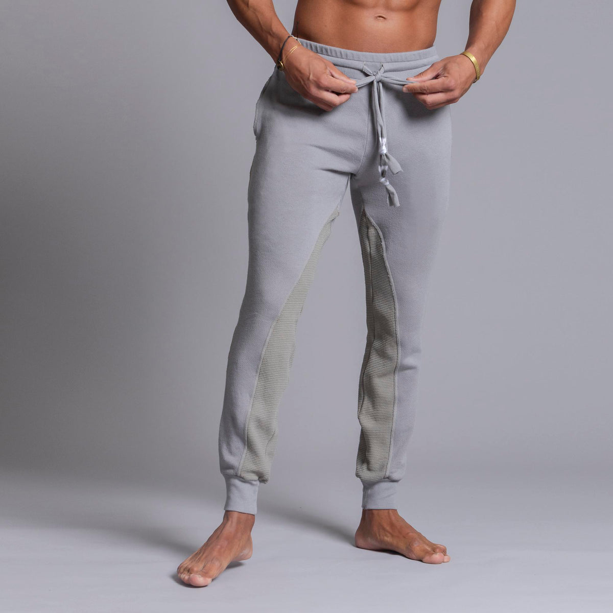A man modeling Deep Clay gray colored jogger pants