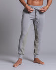 A man modeling Deep Clay gray colored jogger pants