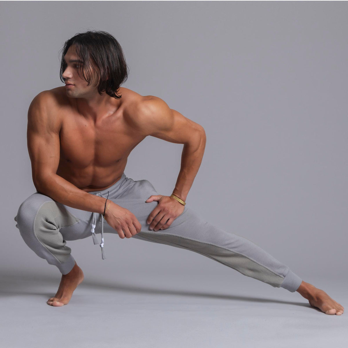 A man modeling Deep Clay gray colored jogger pants