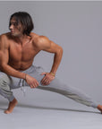 A man modeling Deep Clay gray colored jogger pants