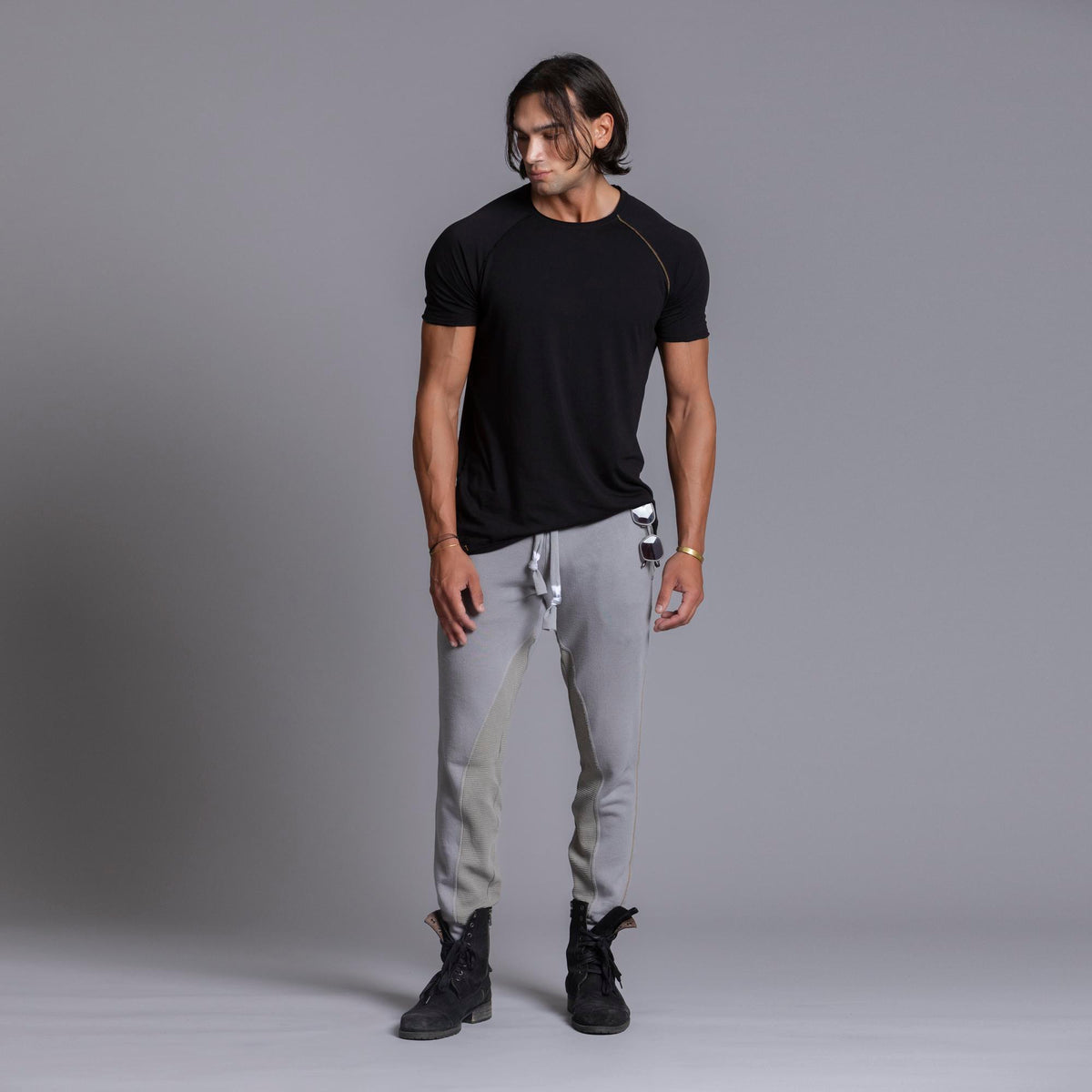 A man modeling Deep Clay gray colored jogger pants
