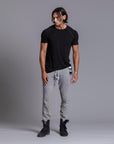 A man modeling Deep Clay gray colored jogger pants