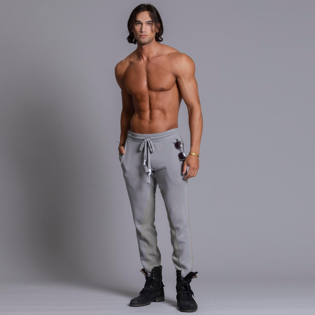 A man modeling Deep Clay gray colored jogger pants