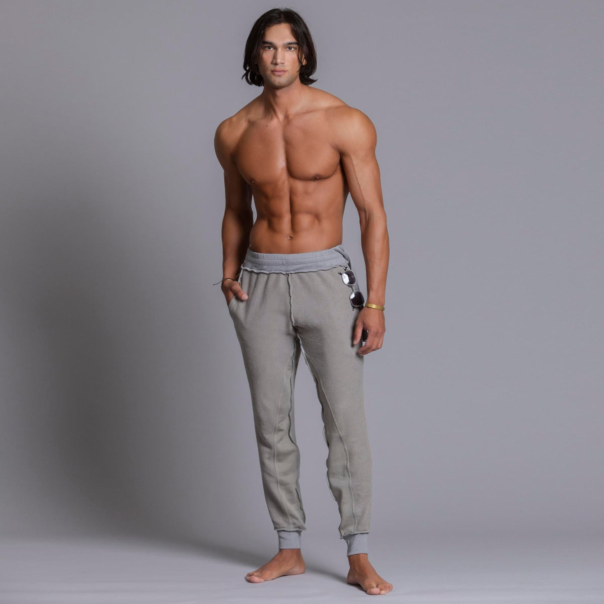 A man modeling Deep Clay gray colored jogger pants