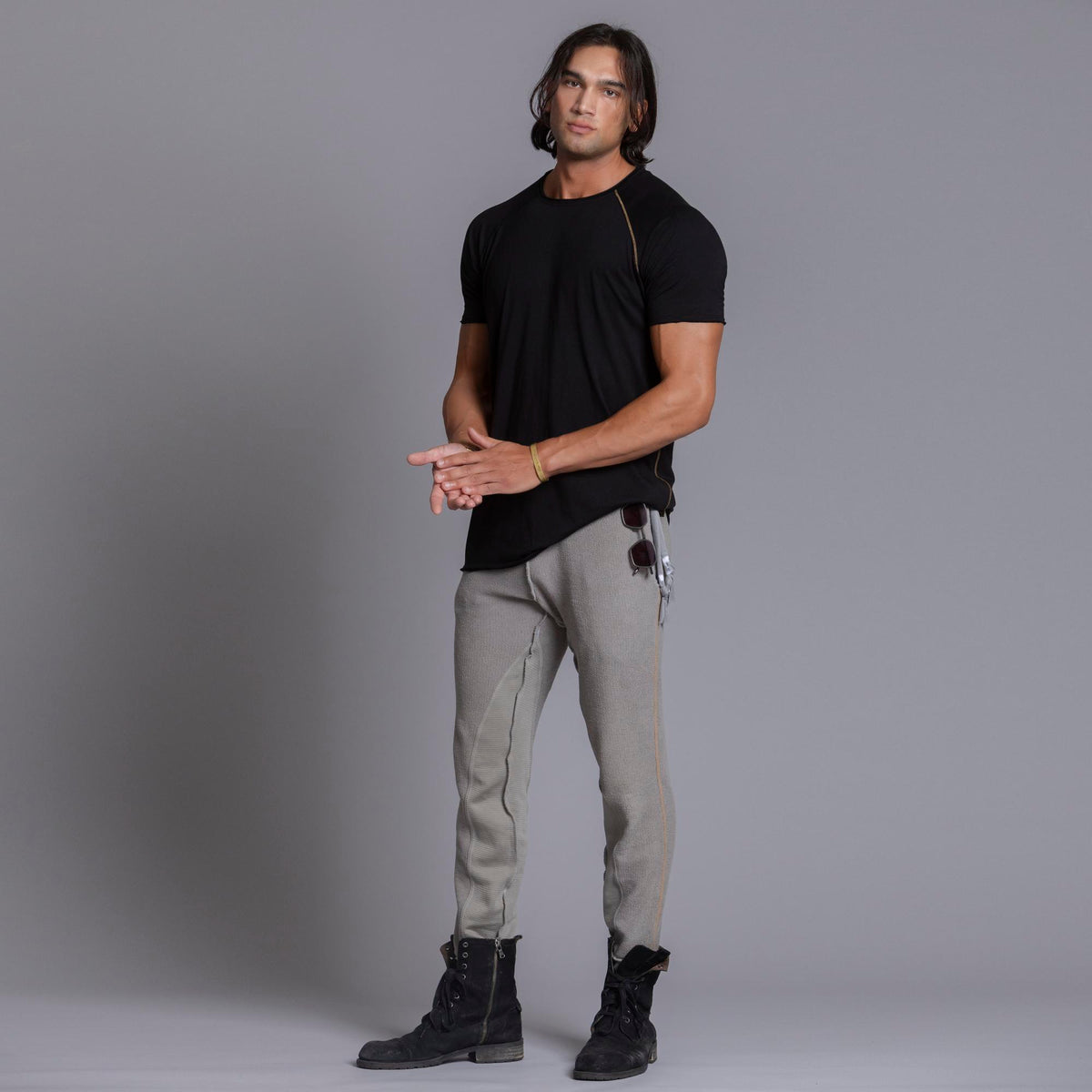 A man modeling Deep Clay gray colored jogger pants
