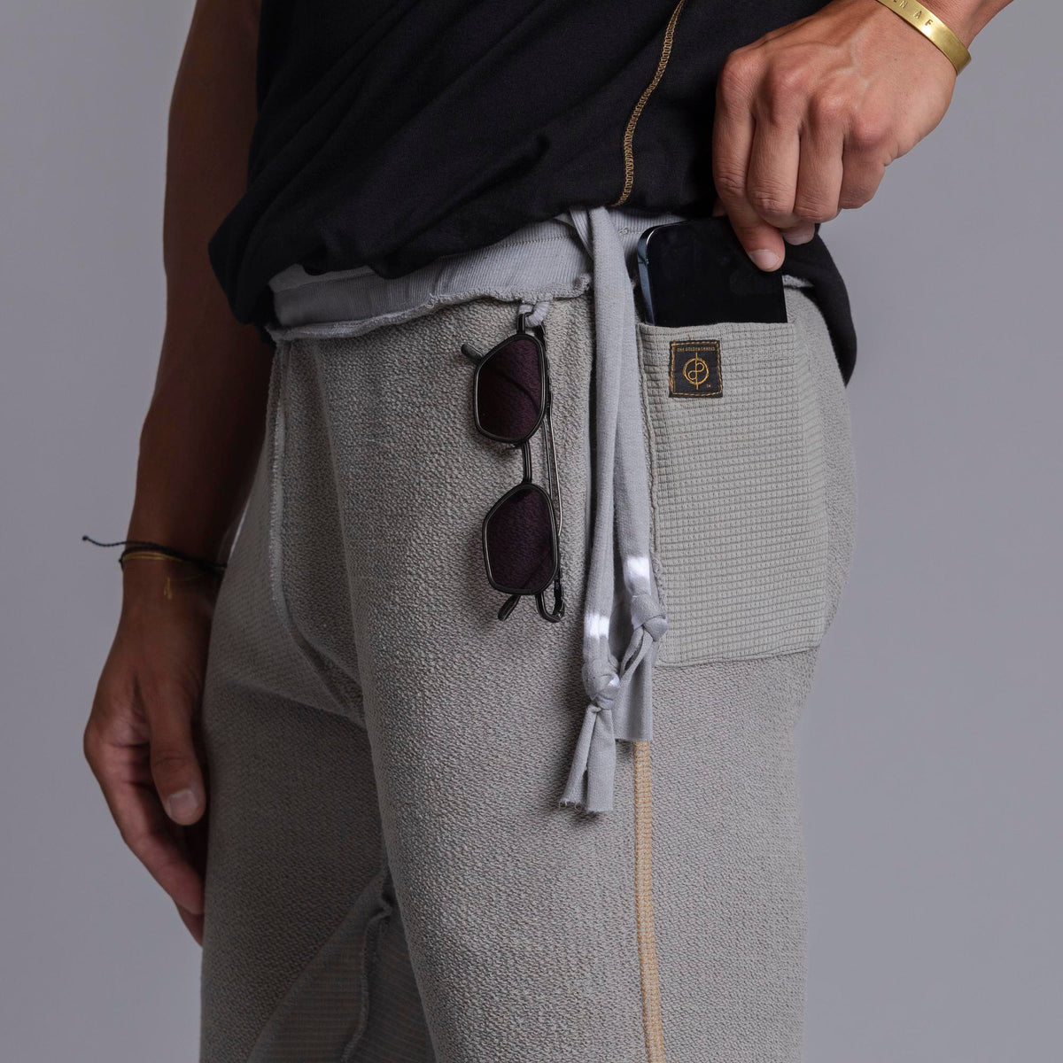 A man modeling Deep Clay gray colored jogger pants