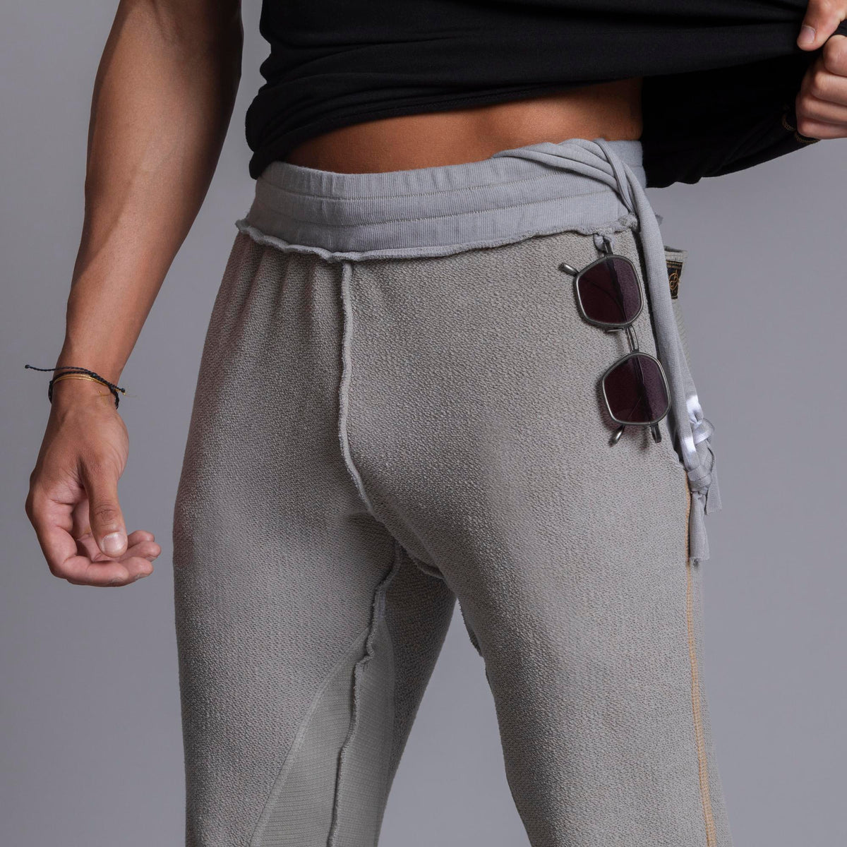 A man modeling Deep Clay gray colored jogger pants