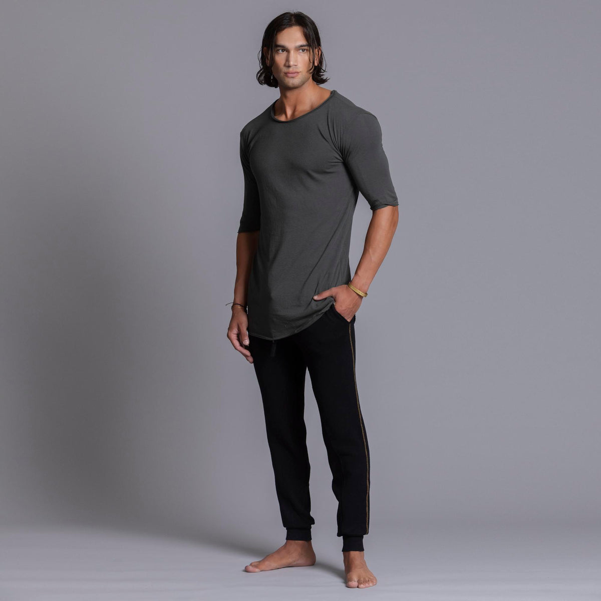 A man modeling black colored jogger pants
